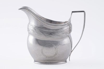 Lot 65 - A George III silver cream jug