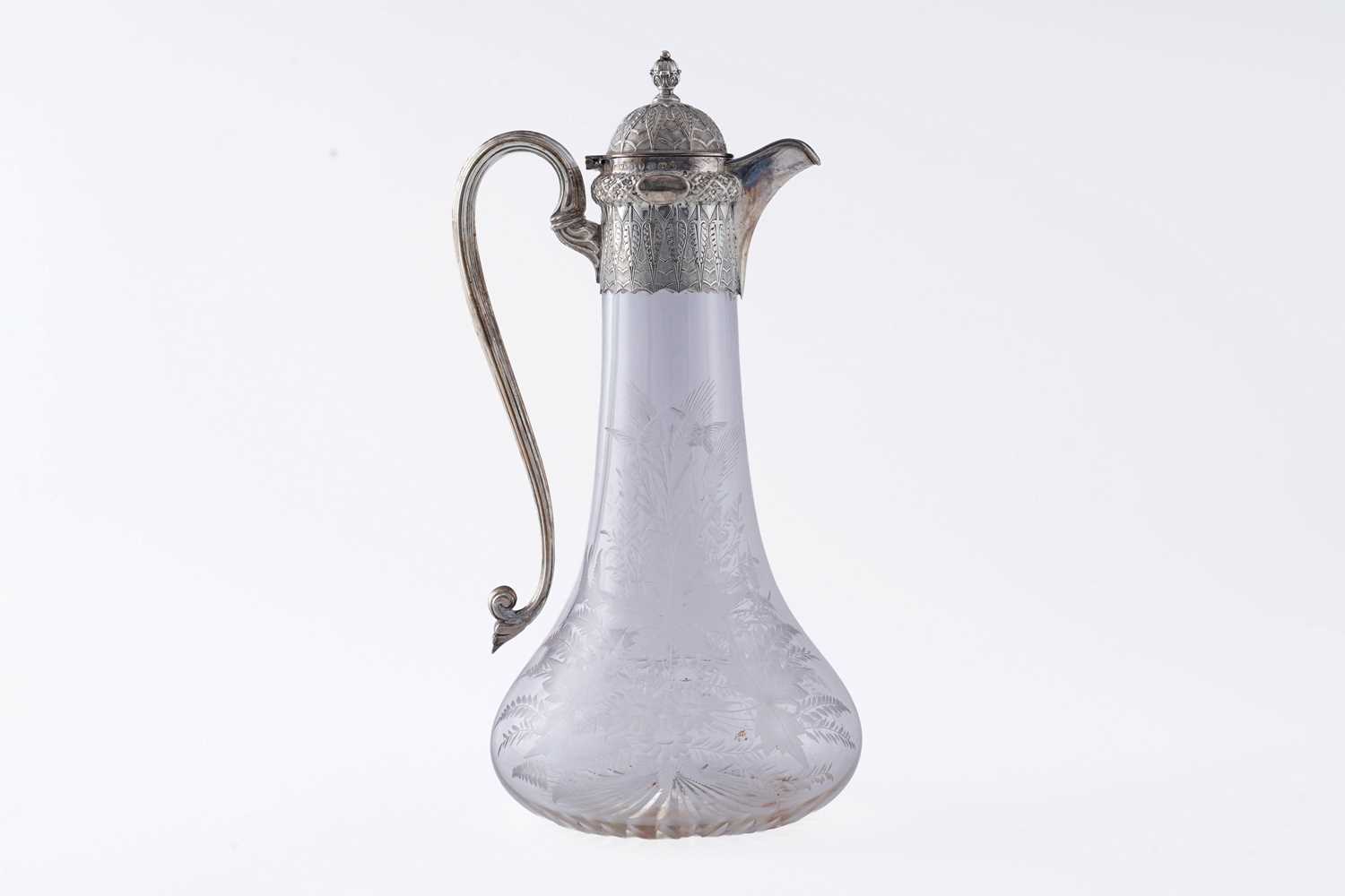 Lot 71 - A Victorian silver mounted clear glass claret jug