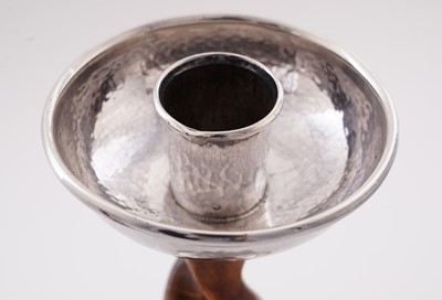 Lot 47 - A pair of George V arts and crafts silver mounted candlesticks