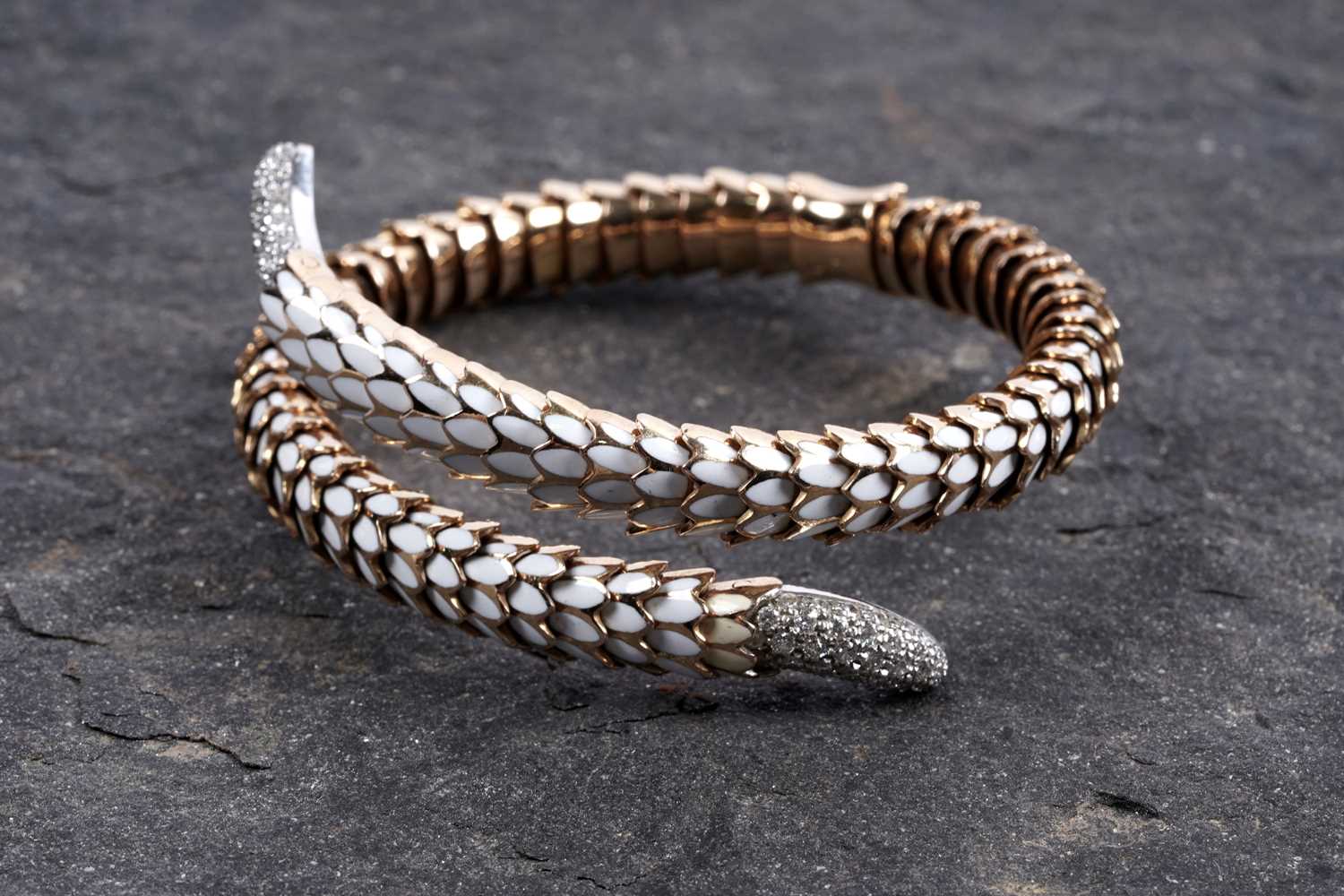 Lot 923 - Roberto Coin: a Snake Collection diamond and gold torque bracelet