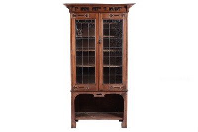 Lot 595 - Manner of Maple & Co for Liberty & Co Ltd London: an Edwardian oak arts and crafts bookcase