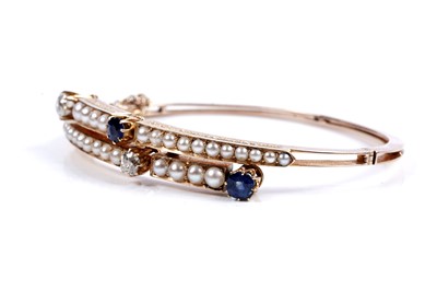 Lot 995 - A fine Victorian diamond, sapphire and half-pearl bangle