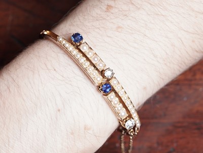 Lot 995 - A fine Victorian diamond, sapphire and half-pearl bangle