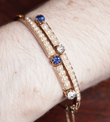 Lot 995 - A fine Victorian diamond, sapphire and half-pearl bangle