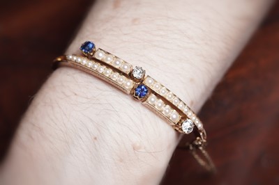 Lot 995 - A fine Victorian diamond, sapphire and half-pearl bangle