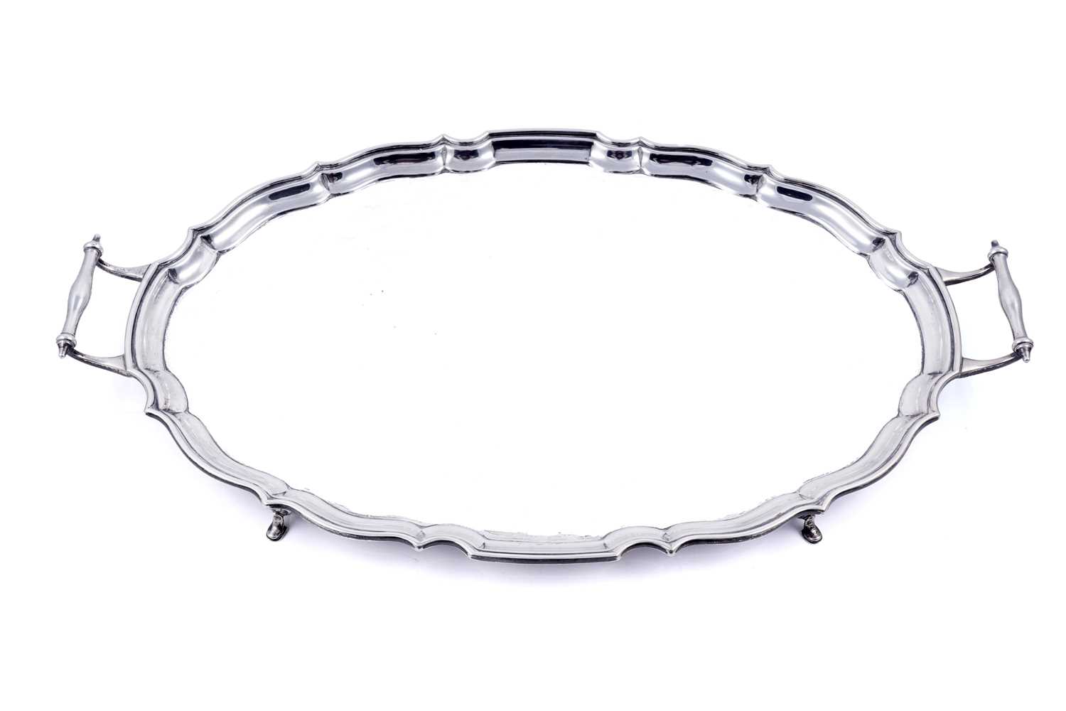 Lot 141 - A George V silver two-handled tray of shaped oval outline