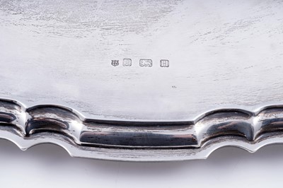 Lot 141 - A George V silver two-handled tray of shaped oval outline