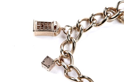 Lot 569 - A 9ct gold curb-link charm bracelet