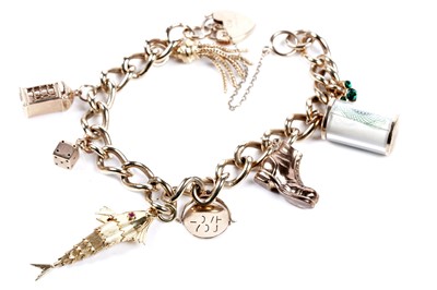 Lot 569 - A 9ct gold curb-link charm bracelet