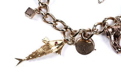 Lot 569 - A 9ct gold curb-link charm bracelet