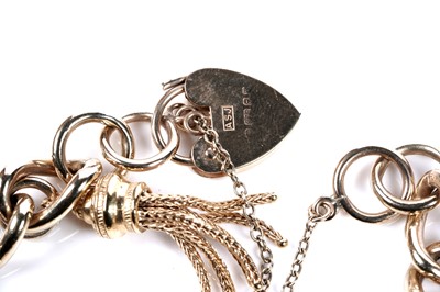 Lot 569 - A 9ct gold curb-link charm bracelet