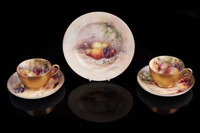 Lot 445 - Two Royal Worcester fruit painted teacups and saucers; and a plate