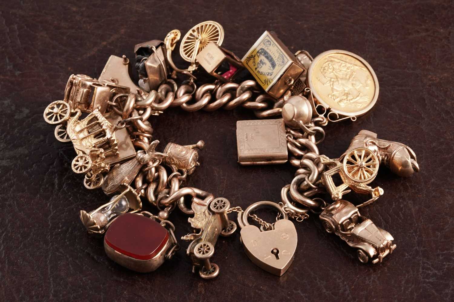 Lot 288 - A 9ct gold charm bracelet