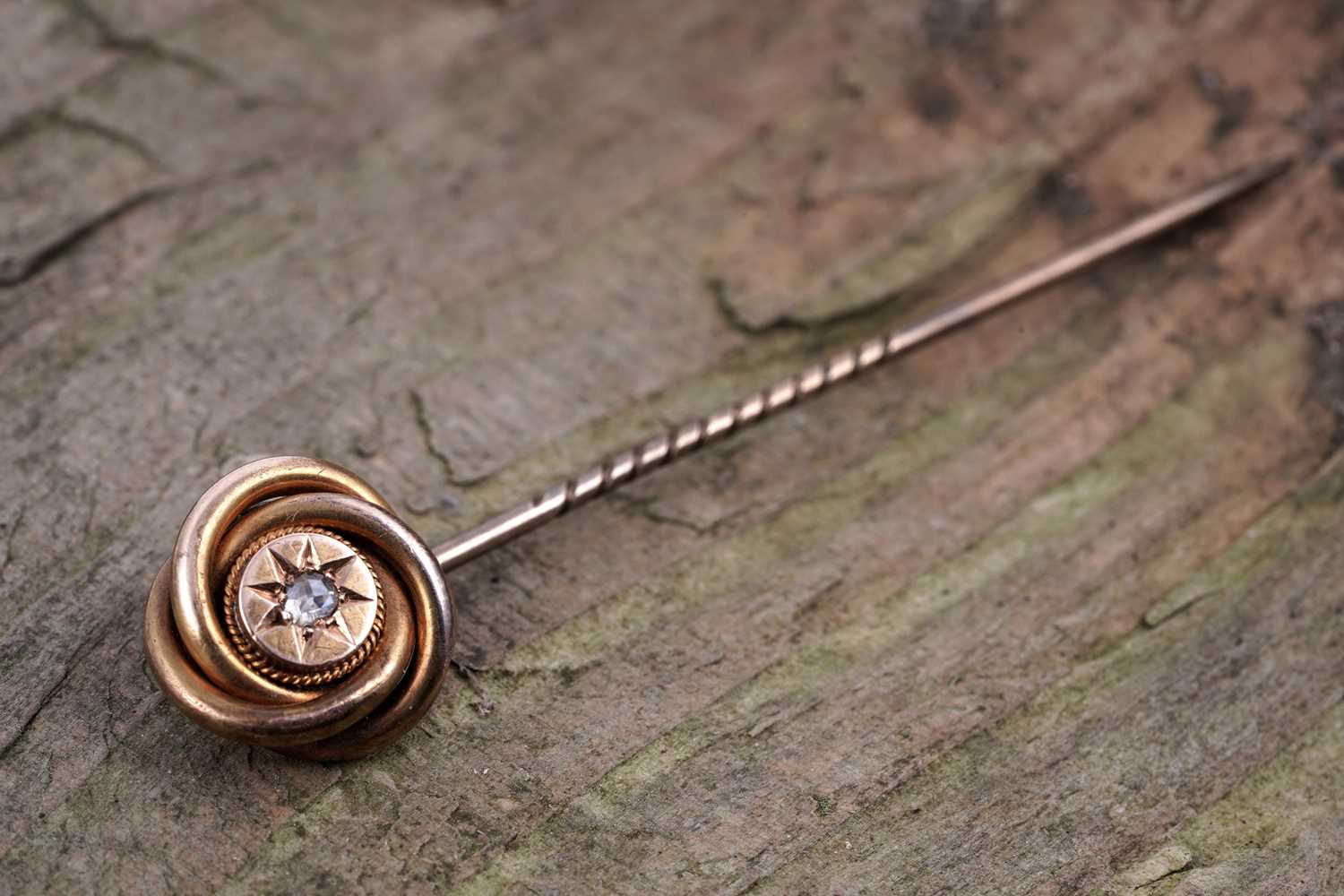 Lot 28 - A Victorian Etruscan Revival diamond tie pin