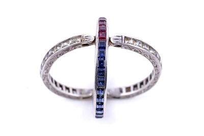 Lot 33 - A sapphire, ruby and white sapphire day-to-night ring