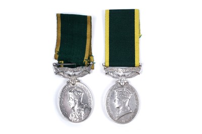 Lot 43 - Four territorial efficiency medals