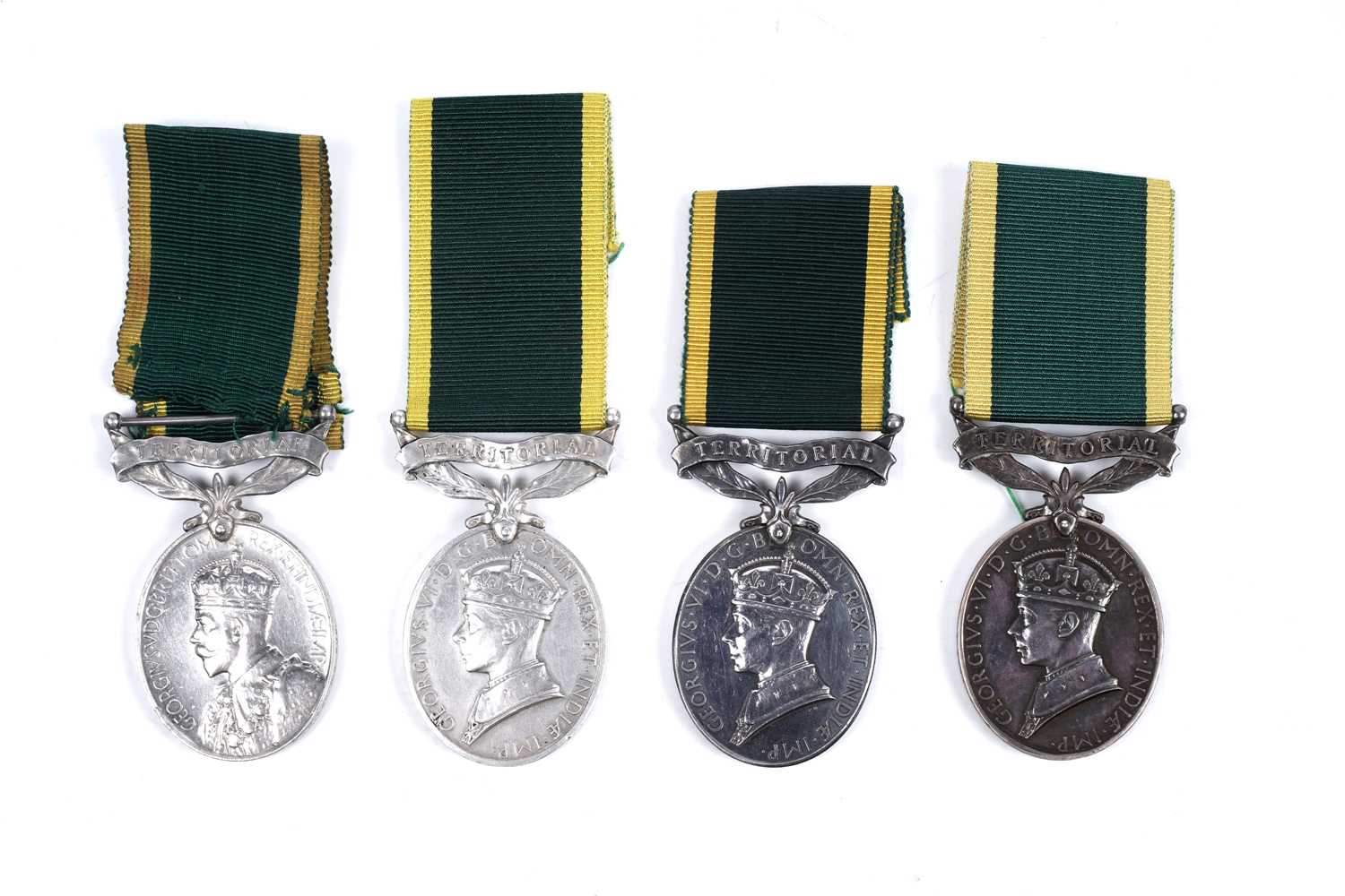 Lot 43 - Four territorial efficiency medals