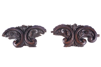 Lot 501 - A pair of Italian carved acanthus scroll walnut capitols or pediments
