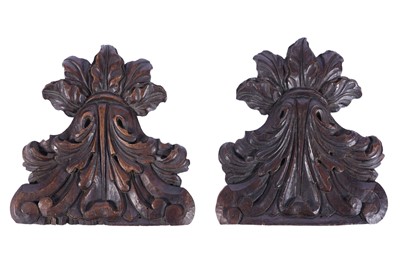 Lot 502 - A pair of Italian carved acanthus leaf design walnut capitols or pediments