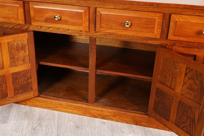 Lot 20 - A contemporary elm three-piece dining room suite