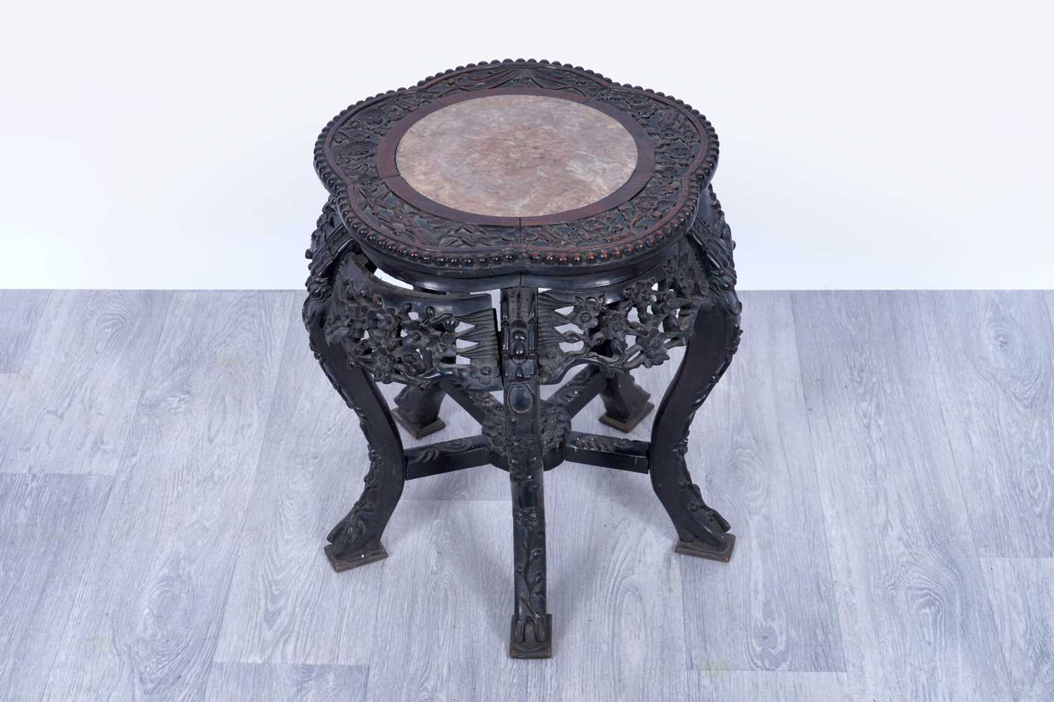 Lot 21 - An early 20th Century carved Chinese hardwood jardinière stand