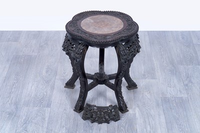 Lot 21 - An early 20th Century carved Chinese hardwood jardinière stand
