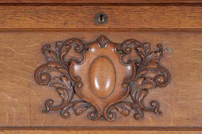 Lot 22 - Robson & Sons Newcastle upon Tyne: an early 20th Century carved oak bureau bookcase