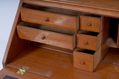 Lot 22 - Robson & Sons Newcastle upon Tyne: an early 20th Century carved oak bureau bookcase