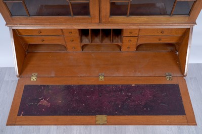 Lot 22 - Robson & Sons Newcastle upon Tyne: an early 20th Century carved oak bureau bookcase