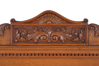 Lot 22 - Robson & Sons Newcastle upon Tyne: an early 20th Century carved oak bureau bookcase