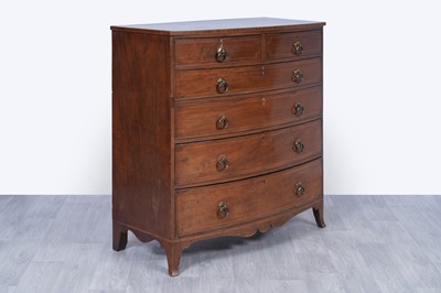 Lot 24 - A George III inlaid mahogany bowfront chest of drawers