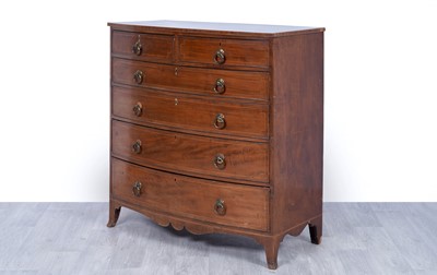 Lot 24 - A George III inlaid mahogany bowfront chest of drawers