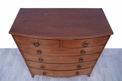 Lot 24 - A George III inlaid mahogany bowfront chest of drawers