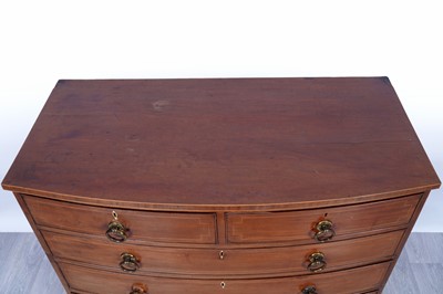 Lot 24 - A George III inlaid mahogany bowfront chest of drawers
