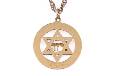 Lot 233 - An 18ct yellow gold Star of David pendant on chain