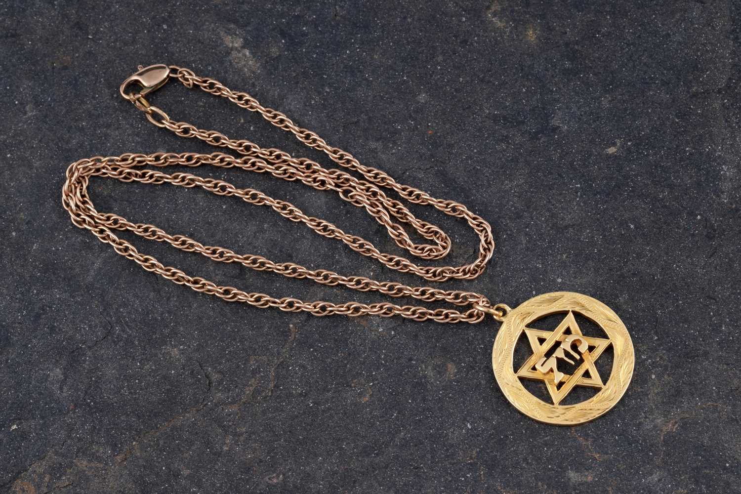 Lot 233 - An 18ct yellow gold Star of David pendant on chain