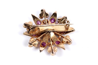 Lot 22 - An Edwardian ruby and split seed pearl brooch