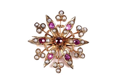 Lot 22 - An Edwardian ruby and split seed pearl brooch