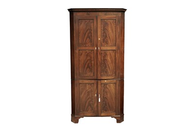 Lot 607 - A George III inlaid mahogany floor standing corner cabinet