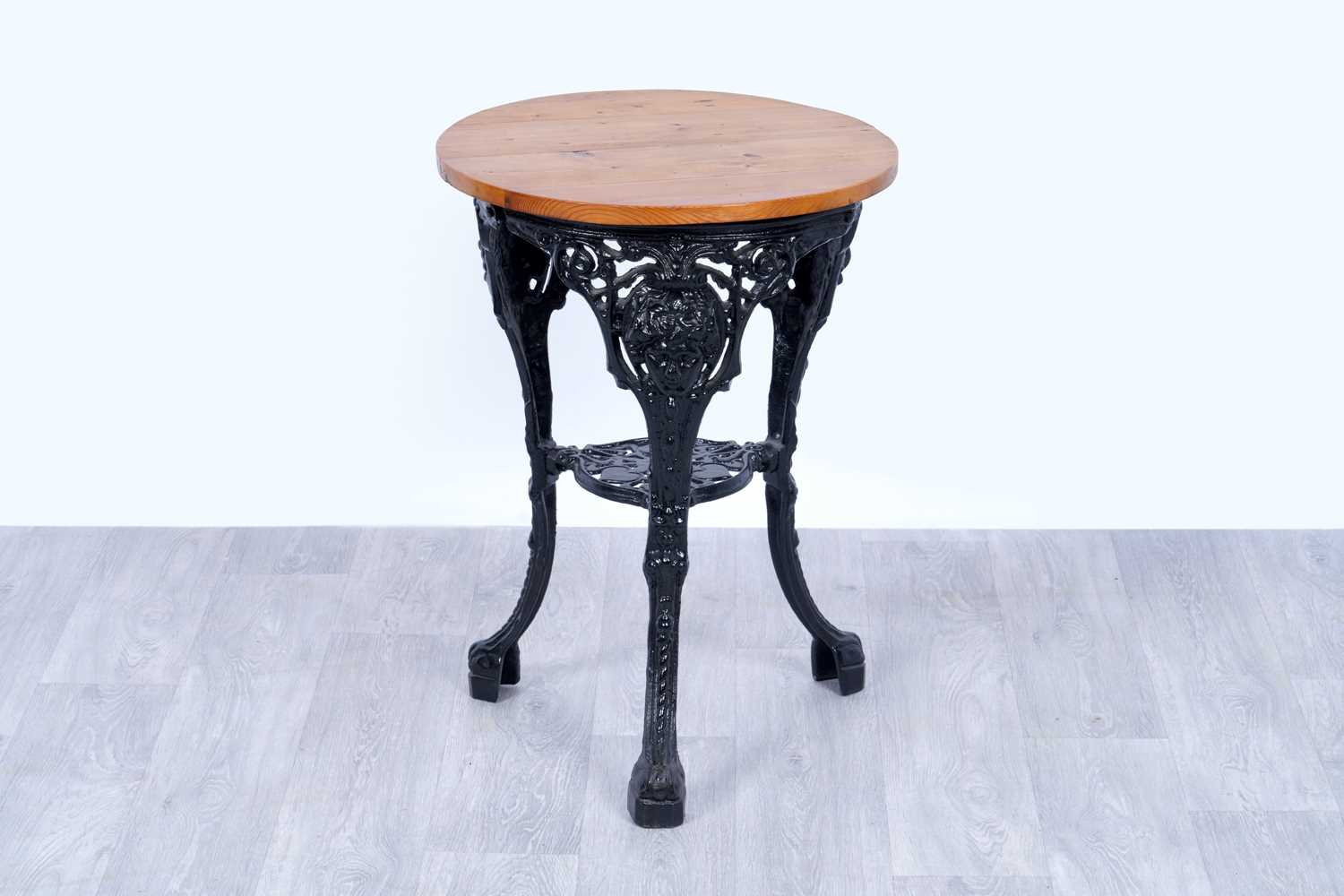 Lot 16 - A cast metal pub table