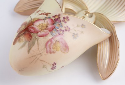 Lot 409 - A pair Royal Worcester wall pockets