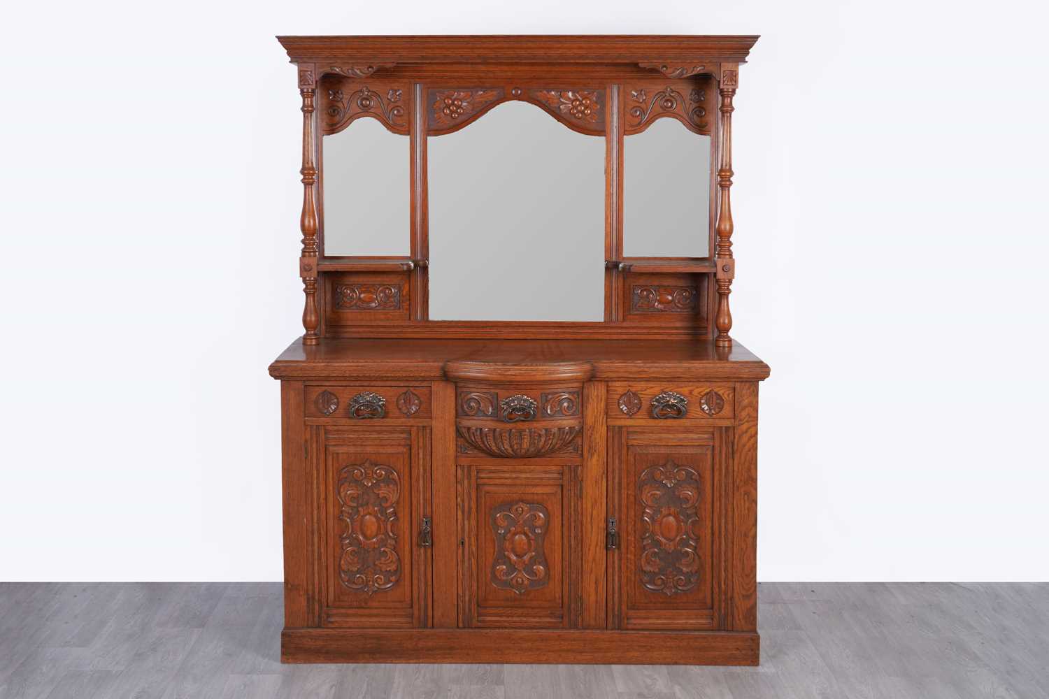 Lot 26 - An Edwardian oak mirror back sideboard