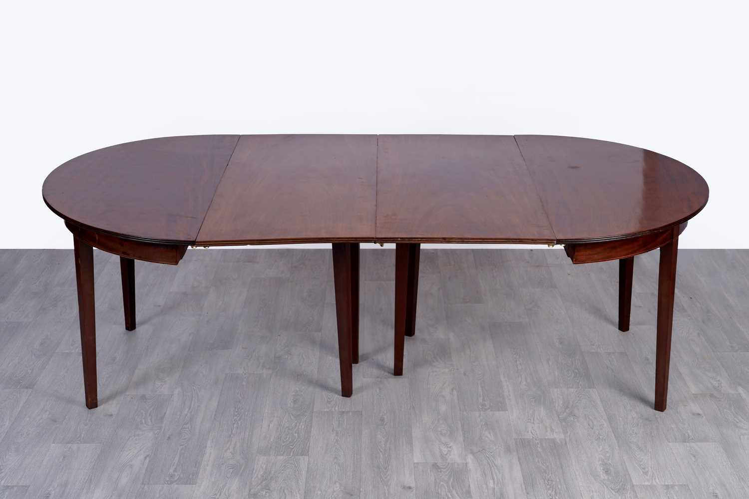 Lot 45 - A pair of Georgian mahogany D-end dining tables; and two additional leaves