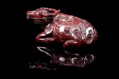 Lot 353 - A Chinese carver red jasper water buffalo