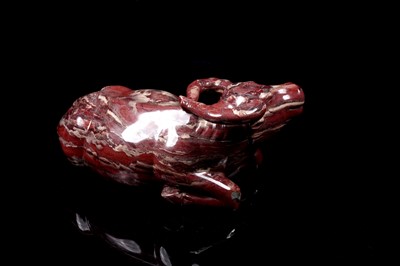 Lot 353 - A Chinese carved red jasper water buffalo