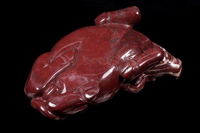Lot 353 - A Chinese carved red jasper water buffalo
