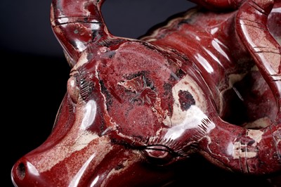Lot 353 - A Chinese carved red jasper water buffalo