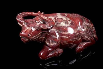 Lot 353 - A Chinese carved red jasper water buffalo