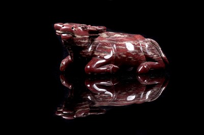 Lot 353 - A Chinese carved red jasper water buffalo