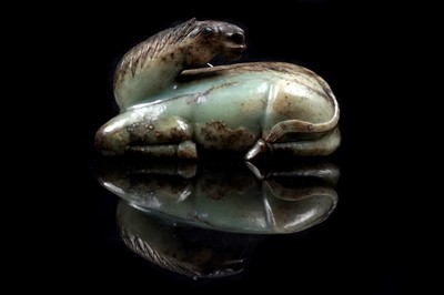 Lot 354 - A Chinese carved jade horse